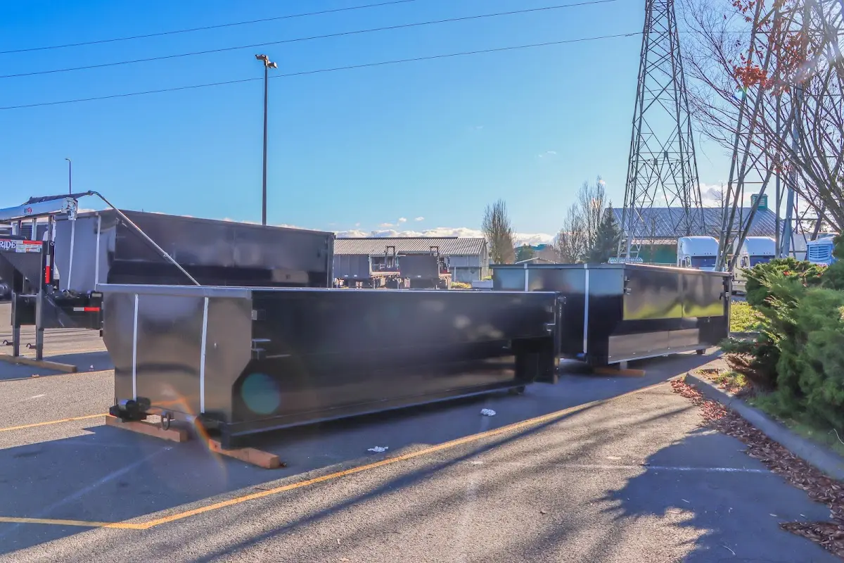 Roll-off dumpster ready for waste disposal at job site for 15 Yard Dumpster Rental in Bedford